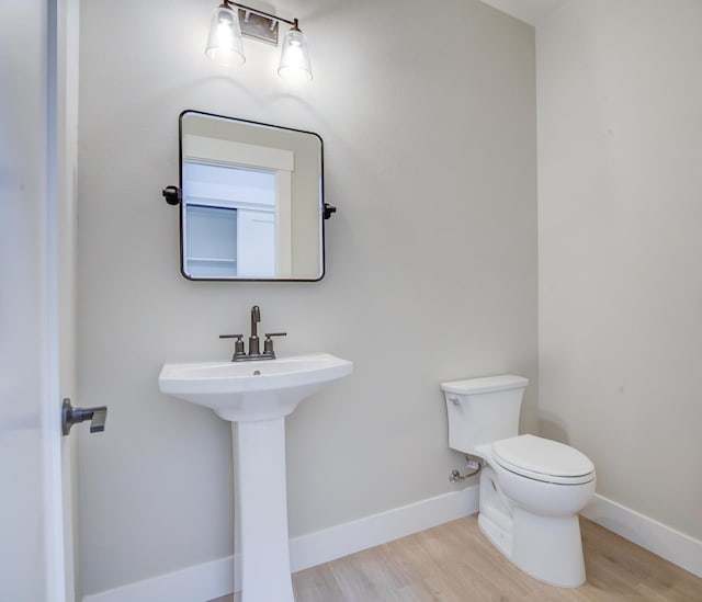 19450 Vista Del Monte Ct, Redding, CA 96003 - half bath with toilet and wood finished floors