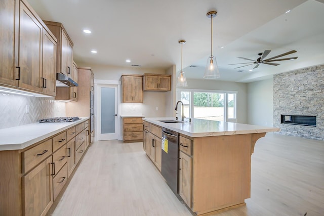 19450 Vista Del Monte Ct, Redding, CA 96003 - kitchen featuring light wood-style flooring, appliances with stainless steel finishes, decorative backsplash, under cabinet range hood, and recessed lighting