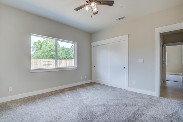 19450 Vista Del Monte Ct, Redding, CA 96003 - unfurnished bedroom featuring carpet, a closet, and ceiling fan