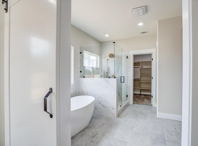 19450 Vista Del Monte Ct, Redding, CA 96003 - full bathroom featuring a marble finish shower, a freestanding tub, a spacious closet, recessed lighting, and marble look tiles
