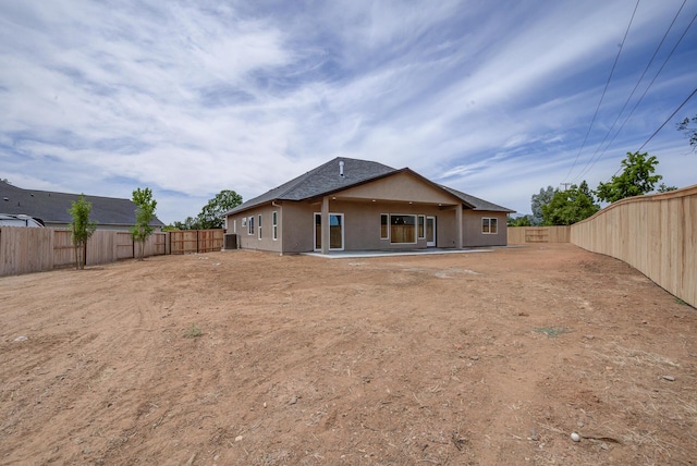19450 Vista Del Monte Ct, Redding, CA 96003 - back of house with stucco siding, a fenced backyard, and a patio area
