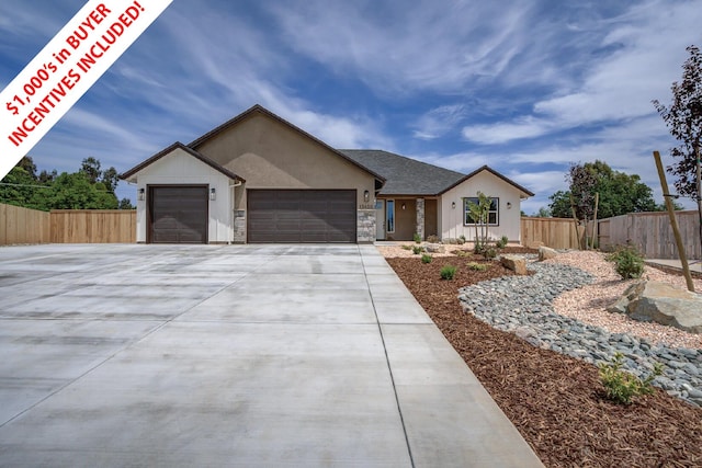 19450 Vista Del Monte Ct, Redding, CA 96003 - ranch-style home featuring an attached garage, driveway, stucco siding, and stone siding