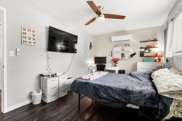 2647 Shasta View Dr, Redding, CA 96002 - bedroom featuring a wall mounted air conditioner, wood finished floors, a textured ceiling, and ceiling fan