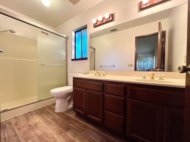 3466 Silverwood St, Redding, CA 96002 - bathroom with a stall shower, double vanity, and wood finished floors