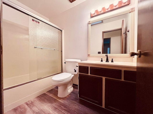 3466 Silverwood St, Redding, CA 96002 - bathroom with vanity, wood finished floors, and shower / bath combination with glass door