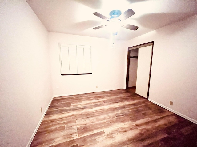 3466 Silverwood St, Redding, CA 96002 - unfurnished bedroom with wood finished floors, a ceiling fan, and a closet