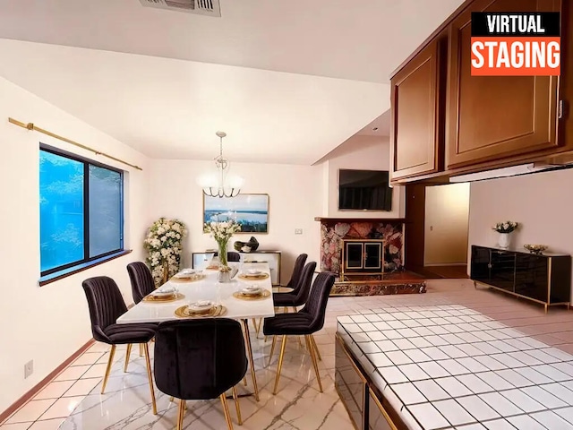 3466 Silverwood St, Redding, CA 96002 - dining area with light marble finish floors, a chandelier, and a premium fireplace