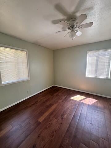 1637 Green St, Redding, CA 96002 - empty room with dark wood-style floors and a ceiling fan