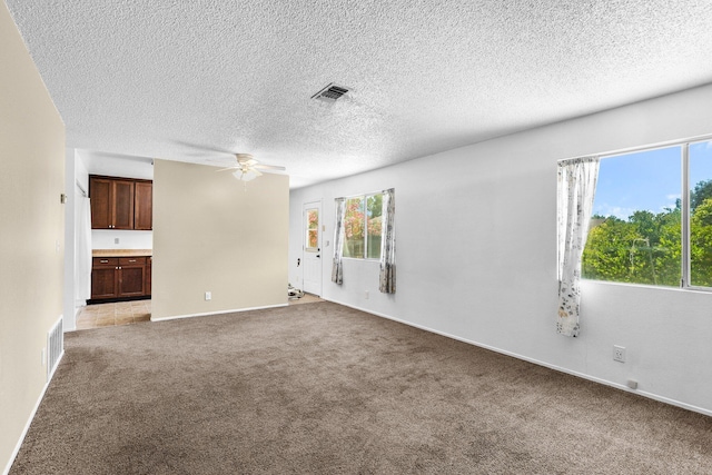 1333 Deborah Dr, Red Bluff, CA 96080 - empty room featuring ceiling fan, carpet flooring, and a textured ceiling