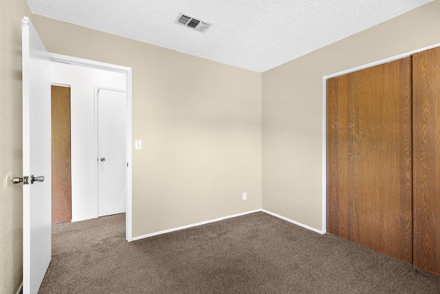 1333 Deborah Dr, Red Bluff, CA 96080 - unfurnished bedroom featuring dark carpet and baseboards