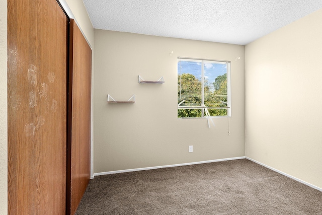 1333 Deborah Dr, Red Bluff, CA 96080 - carpeted empty room featuring a textured ceiling