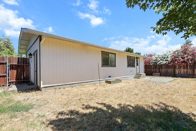 1333 Deborah Dr, Red Bluff, CA 96080 - rear view of house with a fenced backyard and entry steps