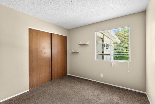 1333 Deborah Dr, Red Bluff, CA 96080 - unfurnished bedroom with carpet floors, a closet, and a textured ceiling