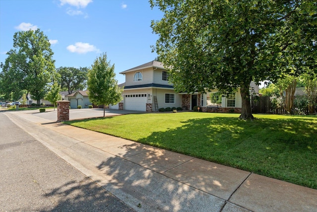 4676 Dandelion Dr, Redding, CA 96002 - view of front of home with an attached garage, stone siding, driveway, and a front yard