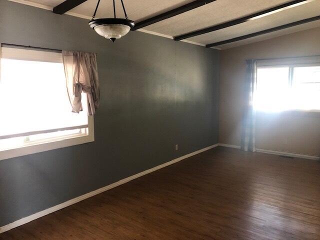 1064 Eagle Nest Rd, Redding, CA 96003 - unfurnished room featuring wood finished floors and beam ceiling