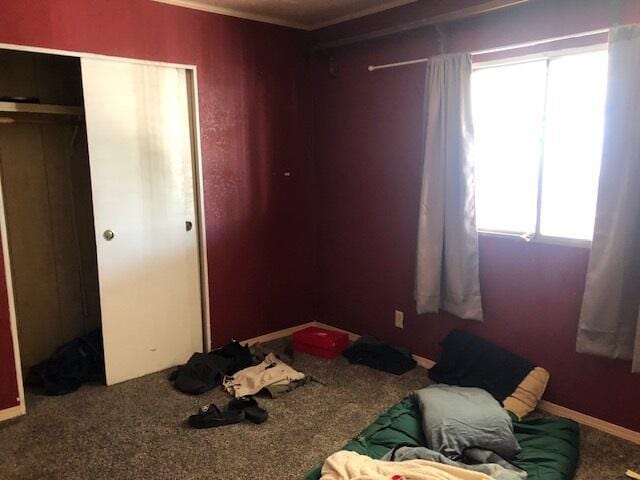 1064 Eagle Nest Rd, Redding, CA 96003 - bedroom featuring a closet, carpet floors, and ornamental molding