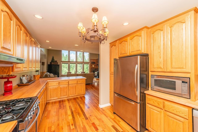 100 Eleanore Ln, Trinity Center, CA 96091 - kitchen featuring appliances with stainless steel finishes, light wood-style floors, a chandelier, open floor plan, and recessed lighting