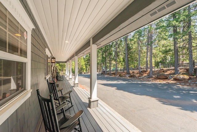 100 Eleanore Ln, Trinity Center, CA 96091 - wooden porch featuring view of wooded area