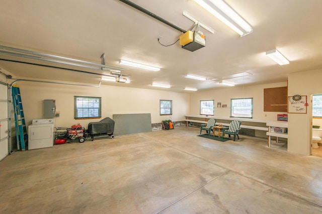 100 Eleanore Ln, Trinity Center, CA 96091 - garage featuring washer / dryer, a garage door opener, and electric panel