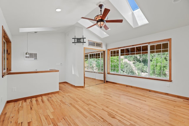 19250 Coal Creek Rd, Lakehead, CA 96051 - unfurnished room with a skylight, hardwood / wood-style flooring, a ceiling fan, high vaulted ceiling, and recessed lighting