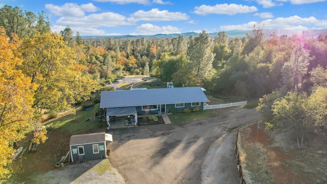 3055 Ryan Ln, Redding, CA 96003 - view from above of property with a heavily wooded area