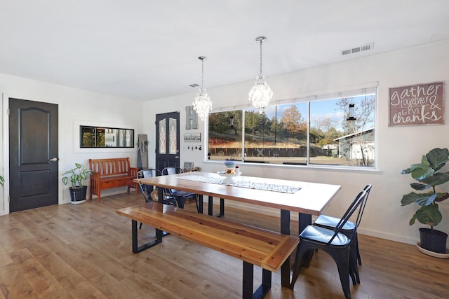 3055 Ryan Ln, Redding, CA 96003 - dining space with a chandelier and wood finished floors