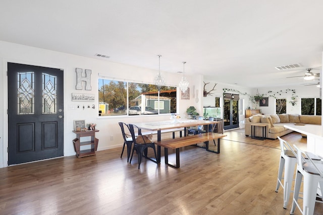 3055 Ryan Ln, Redding, CA 96003 - dining area with light wood finished floors and ceiling fan