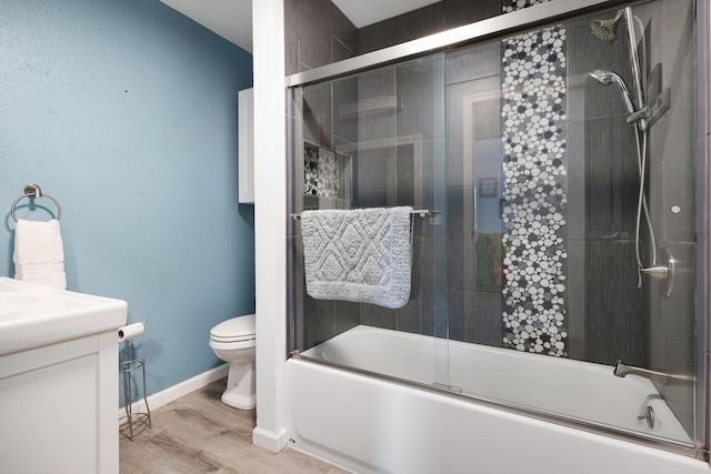 3055 Ryan Ln, Redding, CA 96003 - full bath with combined bath / shower with glass door, vanity, and wood finished floors