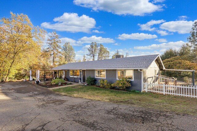 3055 Ryan Ln, Redding, CA 96003 - view of front of property featuring a shingled roof and a chimney