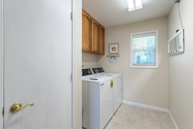 676 Country Oak Dr, Redding, CA 96003 - laundry room with separate washer and dryer, cabinet space, and light tile patterned floors