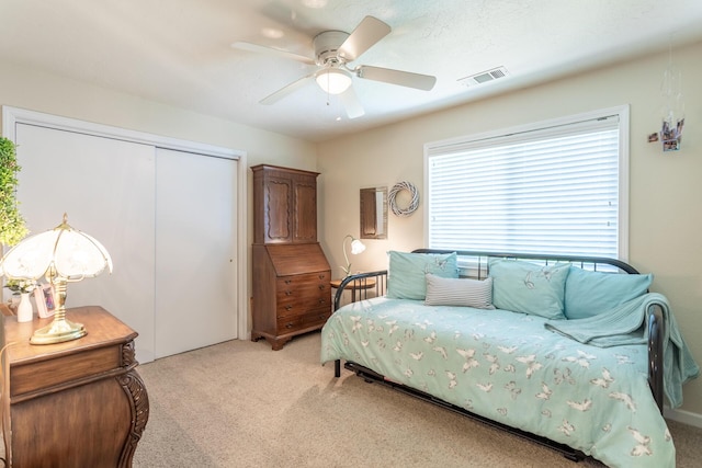 676 Country Oak Dr, Redding, CA 96003 - bedroom with light colored carpet, a closet, and ceiling fan