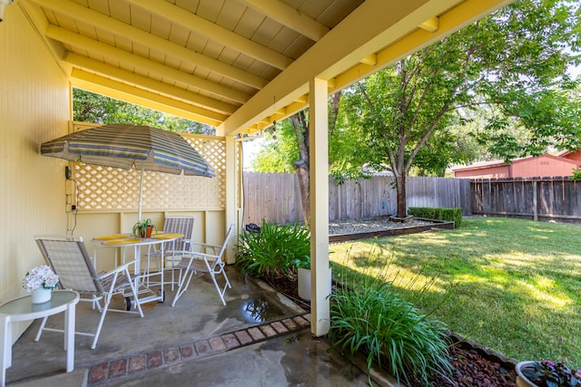 676 Country Oak Dr, Redding, CA 96003 - fenced backyard with a patio and outdoor dining area