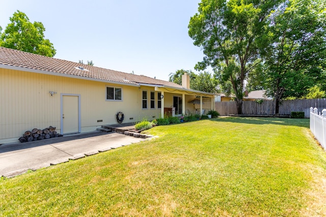 676 Country Oak Dr, Redding, CA 96003 - back of property featuring a chimney, crawl space, and a patio