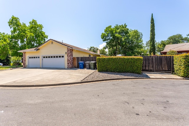 676 Country Oak Dr, Redding, CA 96003 - view of front facade featuring an attached garage and driveway