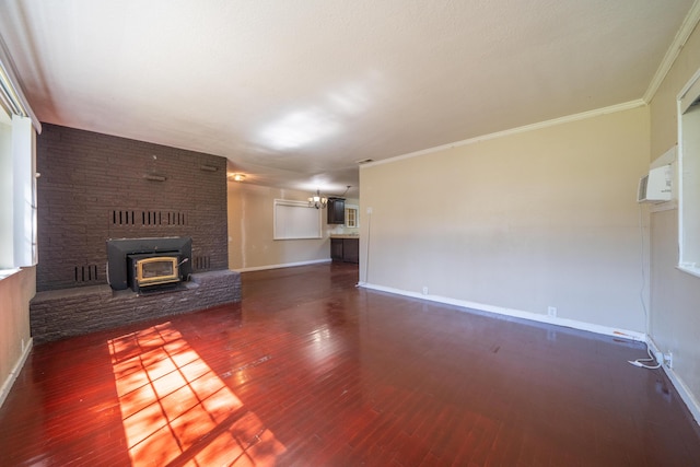 1440 Oakdale Ln, Redding, CA 96002 - unfurnished living room with wood finished floors, a wood stove, and crown molding