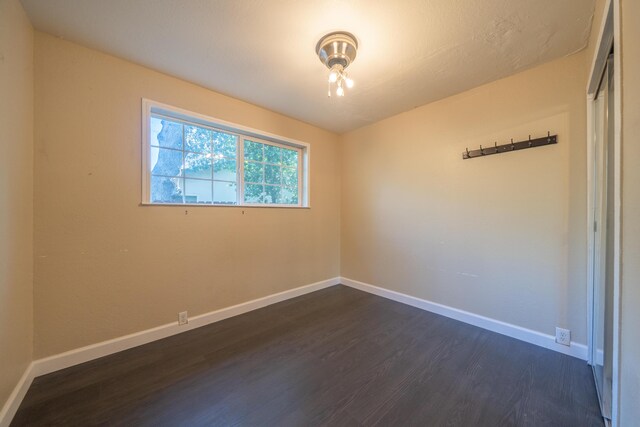 1440 Oakdale Ln, Redding, CA 96002 - empty room featuring dark wood-style floors and baseboards
