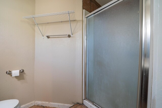 1440 Oakdale Ln, Redding, CA 96002 - bathroom featuring a stall shower and toilet
