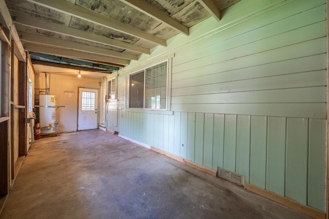 1440 Oakdale Ln, Redding, CA 96002 - interior space with secured water heater, concrete floors, wood walls, and beamed ceiling
