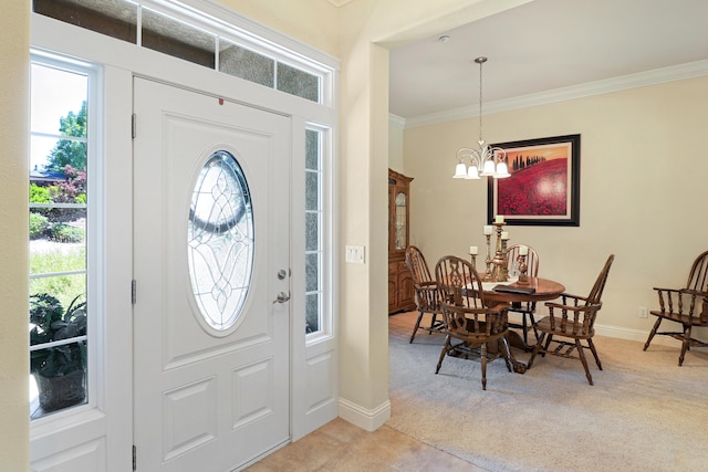 1835 Dellwood Dr, Redding, CA 96003 - foyer entrance with ornamental molding, light colored carpet, and a chandelier