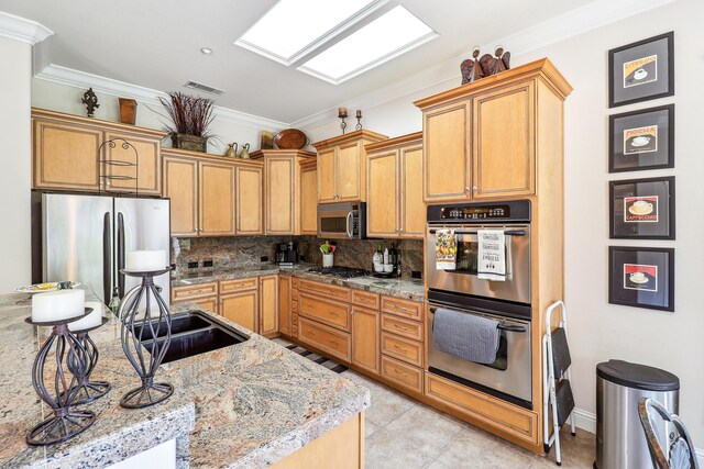 1835 Dellwood Dr, Redding, CA 96003 - kitchen featuring appliances with stainless steel finishes, backsplash, crown molding, light tile patterned floors, and light stone counters