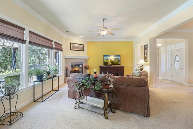 1835 Dellwood Dr, Redding, CA 96003 - living room featuring carpet floors, healthy amount of natural light, ornamental molding, a ceiling fan, and a tile fireplace