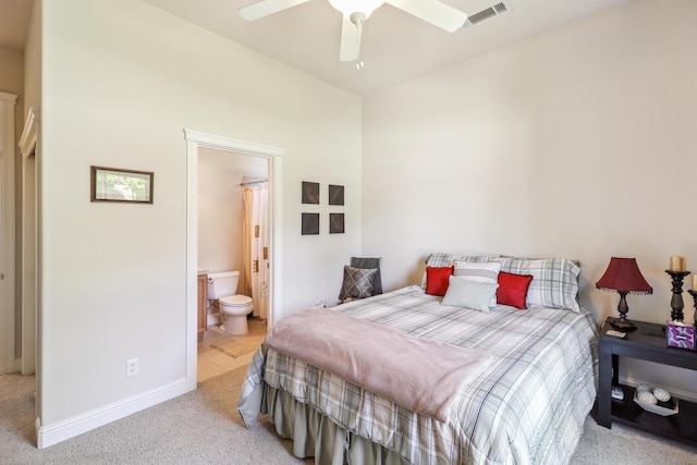 1835 Dellwood Dr, Redding, CA 96003 - bedroom with light colored carpet, connected bathroom, and a ceiling fan