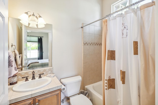 1835 Dellwood Dr, Redding, CA 96003 - ensuite bathroom featuring vanity, tasteful backsplash, and shower / bath combo