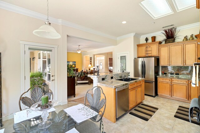 1835 Dellwood Dr, Redding, CA 96003 - kitchen with stainless steel appliances, tasteful backsplash, ornamental molding, a kitchen island with sink, and pendant lighting
