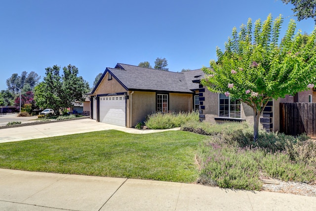 1835 Dellwood Dr, Redding, CA 96003 - view of front of house with driveway, stucco siding, and an attached garage