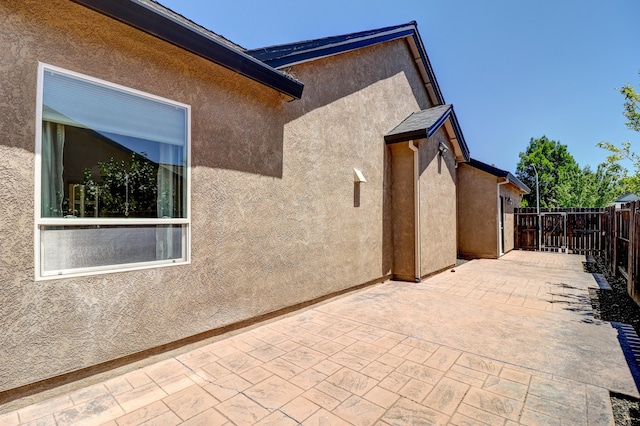 1835 Dellwood Dr, Redding, CA 96003 - view of home's exterior featuring a patio area and stucco siding