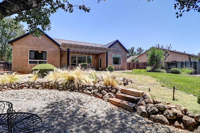 1835 Dellwood Dr, Redding, CA 96003 - view of front of home featuring a pergola, a fenced backyard, a patio, and stucco siding