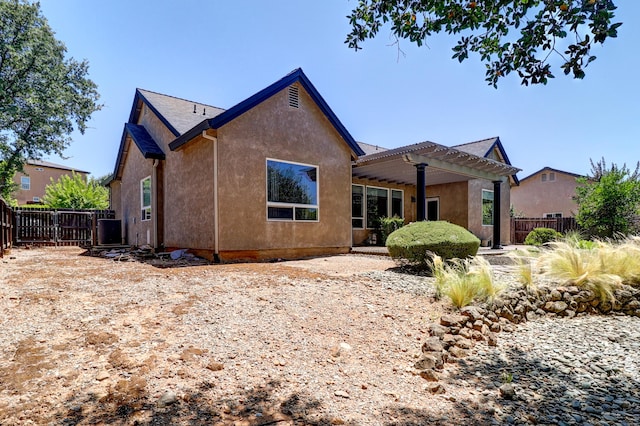 1835 Dellwood Dr, Redding, CA 96003 - back of property featuring a pergola and stucco siding