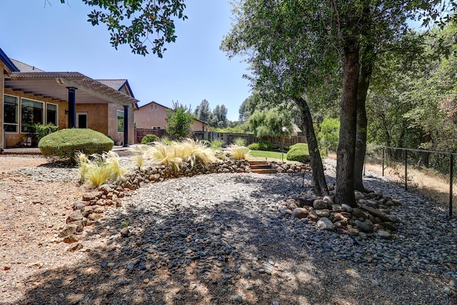 1835 Dellwood Dr, Redding, CA 96003 - fenced backyard with a pergola