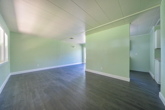 1430 Oakdale Ln, Redding, CA 96003 - unfurnished living room featuring dark wood-type flooring